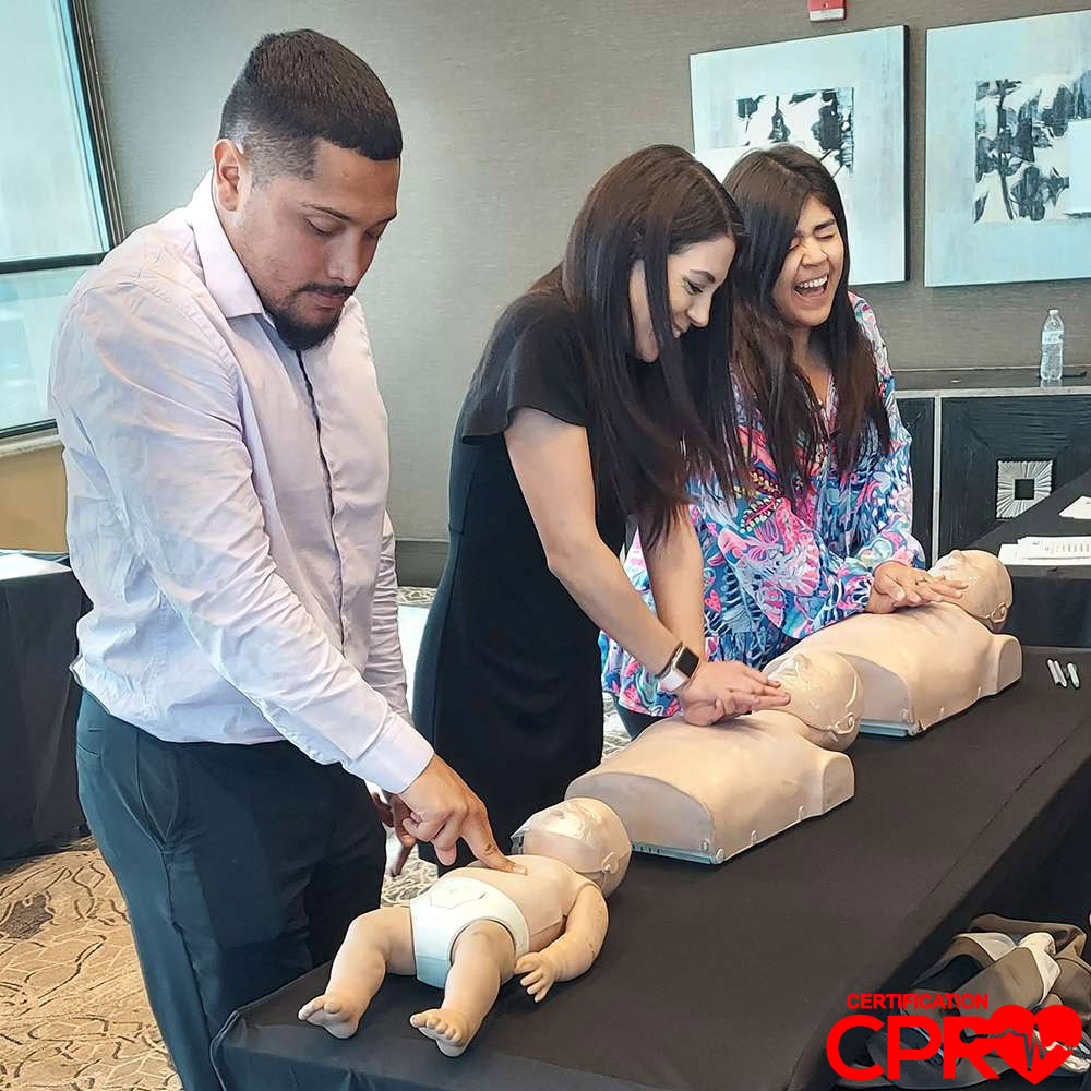 CPR training class in Chicago with students practicing on mannequins.